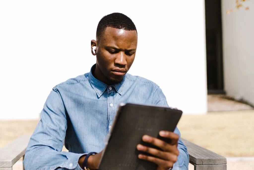 Man viewing tablet.