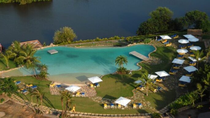 An aerial view of a beach resort with a pool. Photo Courtesy of whitesandsholidays.com